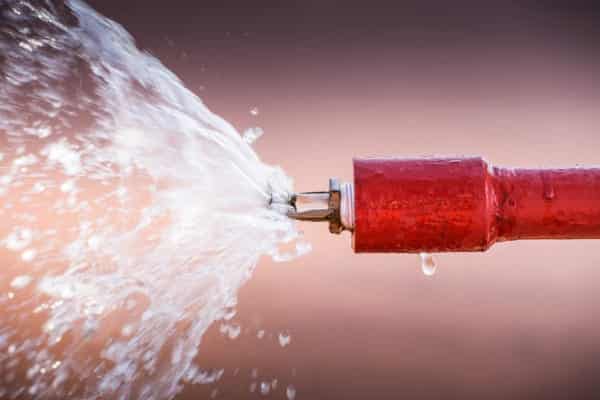 What causes a fire sprinkler to activate?