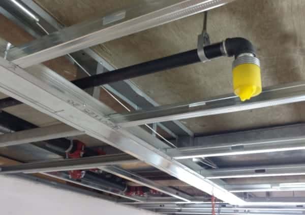 A dropped ceiling in a fire sprinkler retrofit