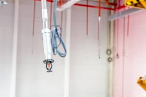 Flexible fire sprinkler drops in a ceiling