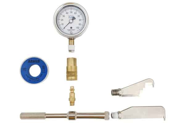 The parts of a brand-new pitot gauge, placed for easy view and assembly.