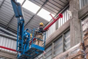 Installing sprinkler pipe