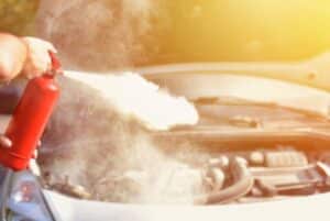 Fire extinguisher used on a car