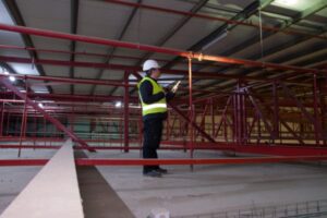 A fire sprinkler contractor inspecting a piping system